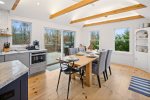 Bright dining room surrounded by windows